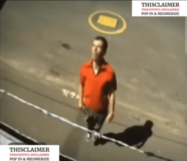 A man jumping to try and see over a tall wall, only to notice barbed wire at the top. A man jumping to try and see over a tall wall, only to notice barbed wire at the top.
