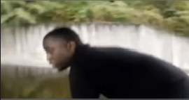 vA man jumps from a fishing boat as it approaches a waterfall.