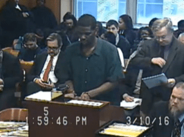 Brian Earl Taylor standing in court after singing his apology.