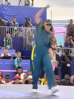 Rachael Gunn with one arm up and one arm down in a humorous pose.