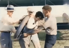 Gladys, assisted by three colleagues, readies the spare wheel for the midair repair daring operation.