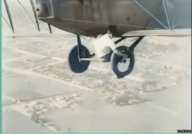 Gladys working on the plane’s landing gear, carefully installing the new wheel while in flight.