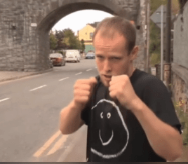 A man telling a story about meeting a lookalike outside a nightclub in Langan Village.