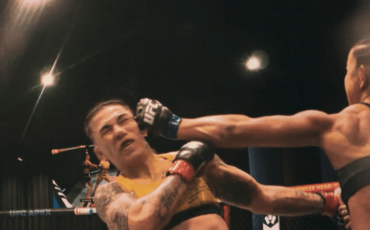 A photo of Natalia Silva celebrating her victory over Jessica Andrade in the UFC Octagon.