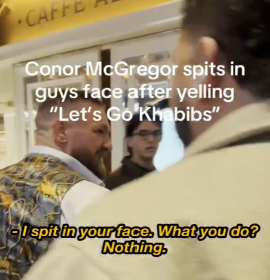 Conor McGregor standing confidently after allegedly spitting at a fan, captured mid-sentence saying, "I spit in your face and you did nothing."
