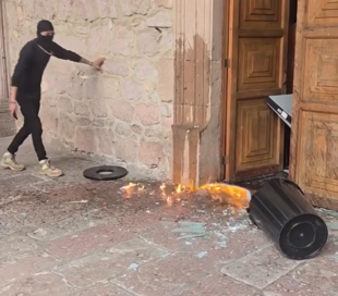 Individuals strike metal barriers and damage street fixtures while smoke and scattered debris appear on the ground.