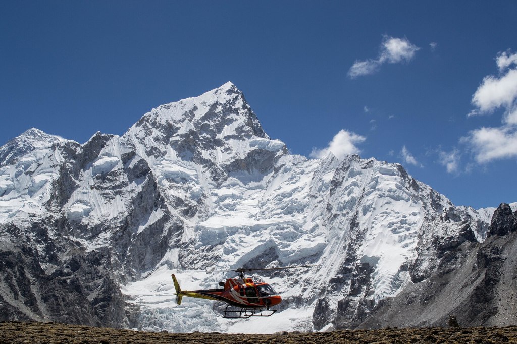 A helicopter lifting off near Everest Base Camp in Nepal.