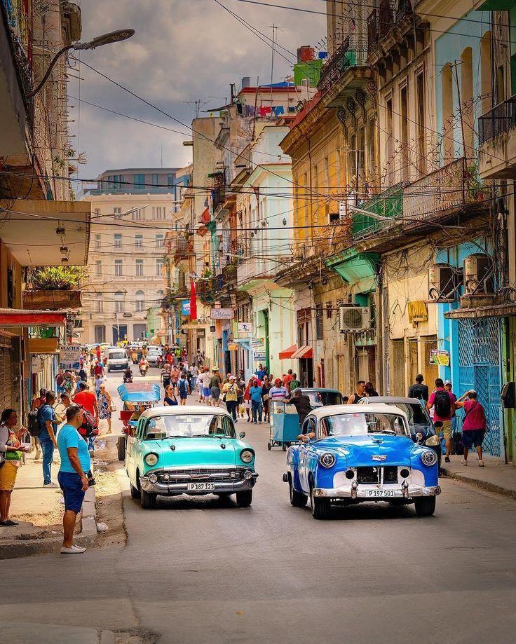 Street scene in Havana, Cuba showing pedestrians, buildings and everyday city life.
