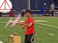 Young junior aerospace engineering world champion preparing to launch his F-1D model aircraft into flight.